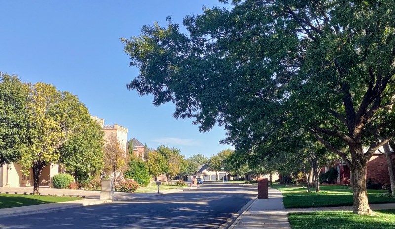residential street as seen from a bike in the early fall 93rd Drive, Lubbock, Texas