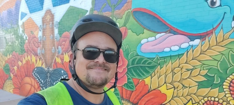 picture of me (James M. Branum) in front of a mural in downtown Piedmont, OK