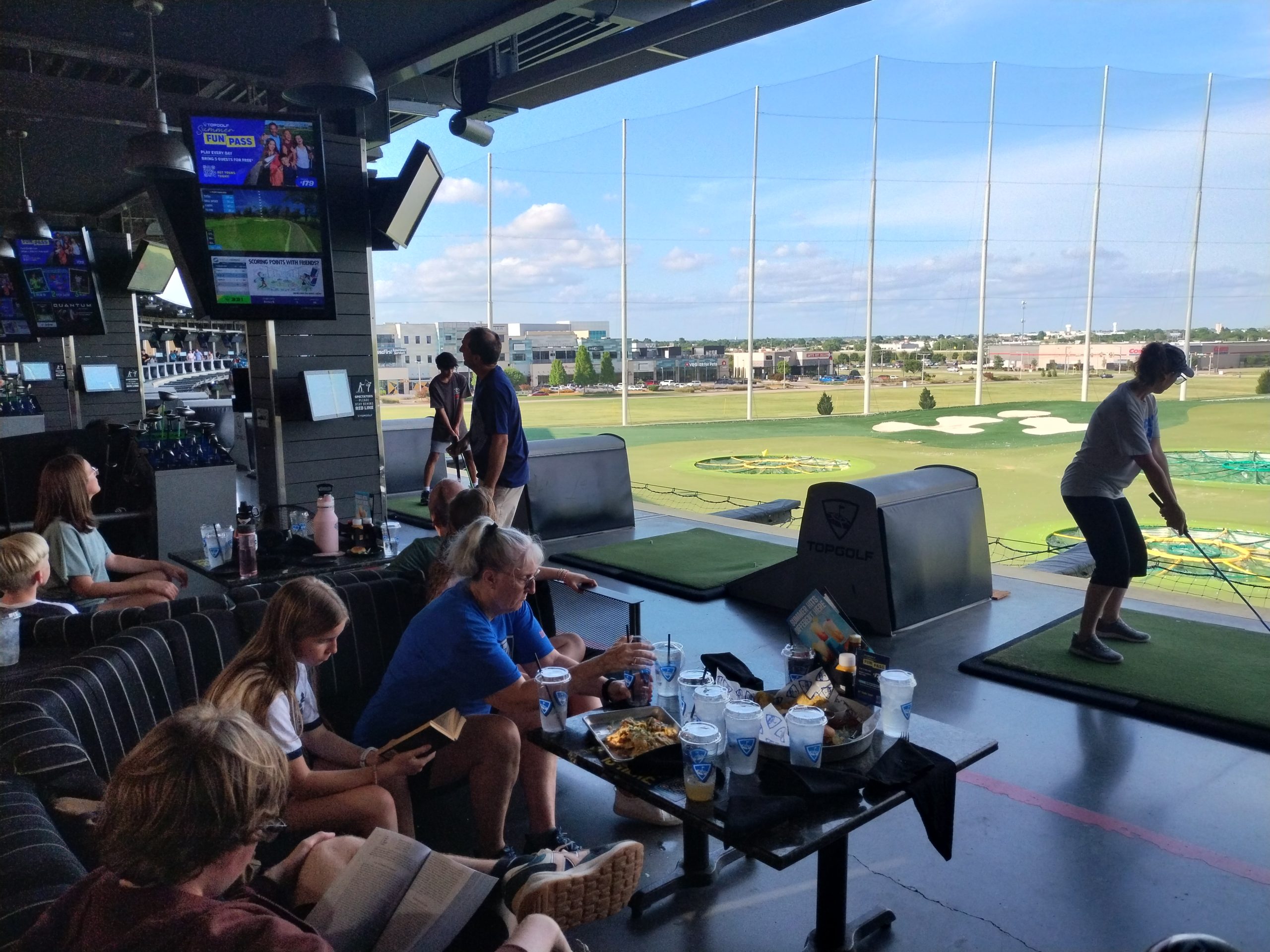 extended family playing at Top Golf